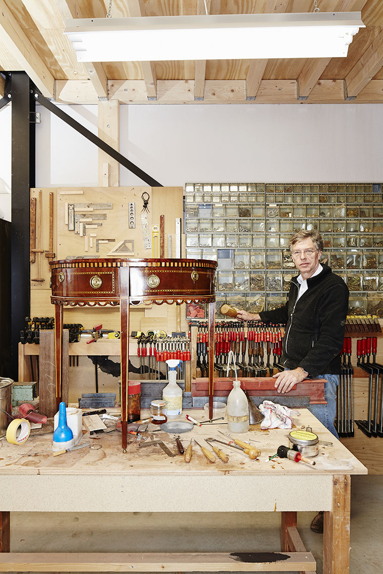 Portrait of joiner in his workshop, meubelmaker in werkplaats